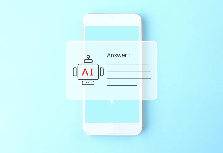 スマホ画面にAIチャットボットのアイコンと「Answer:」の文字